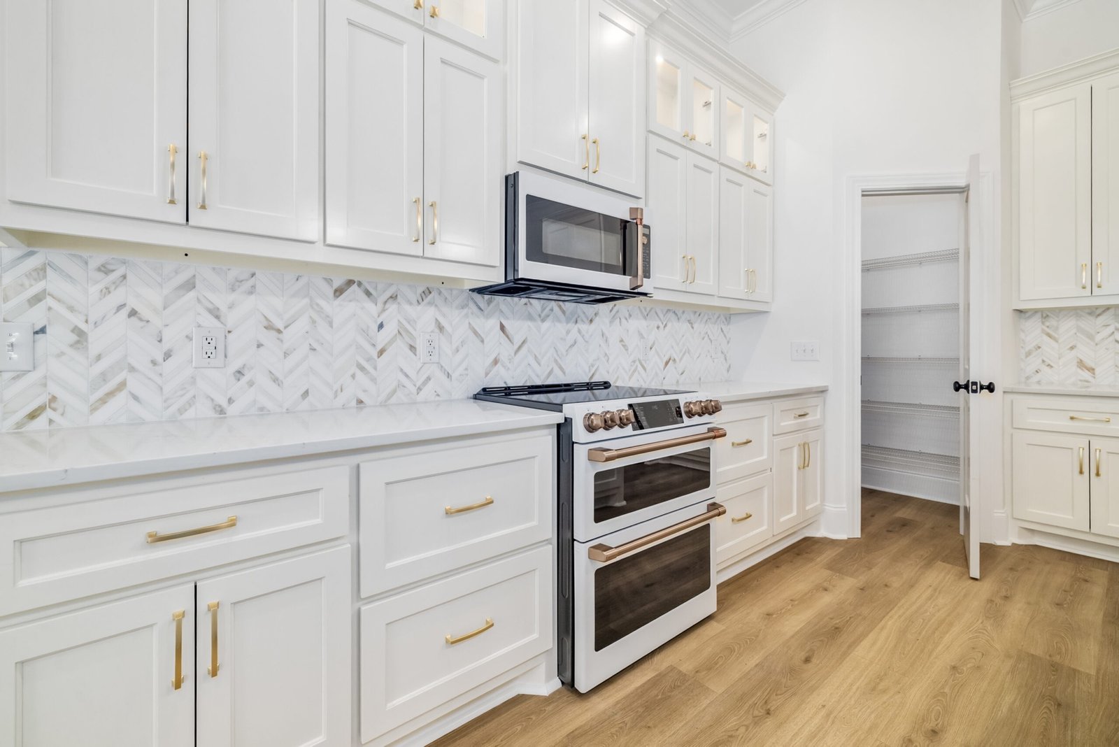 Custom kitchen millwork and finishes at 215 80th Ave