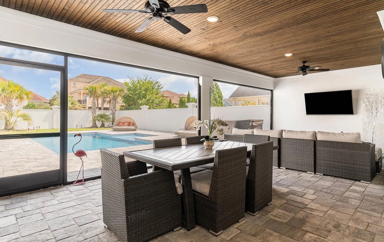 Covered outdoor living space with pool at Bluffview