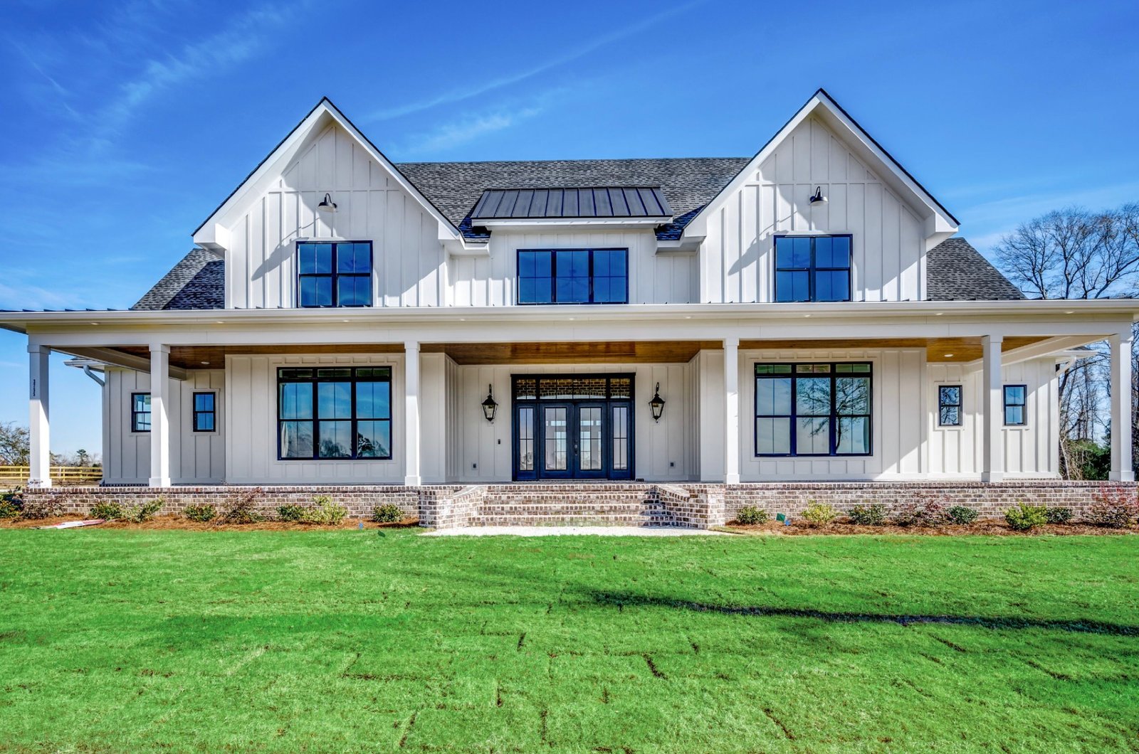 Custom farmhouse with wrap-around porch at 3751 Highway 319