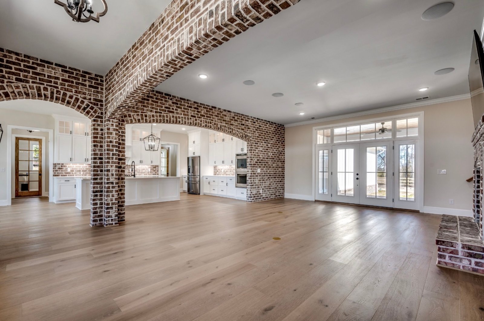 Great room with exposed brick and timber at 3751 Highway 319