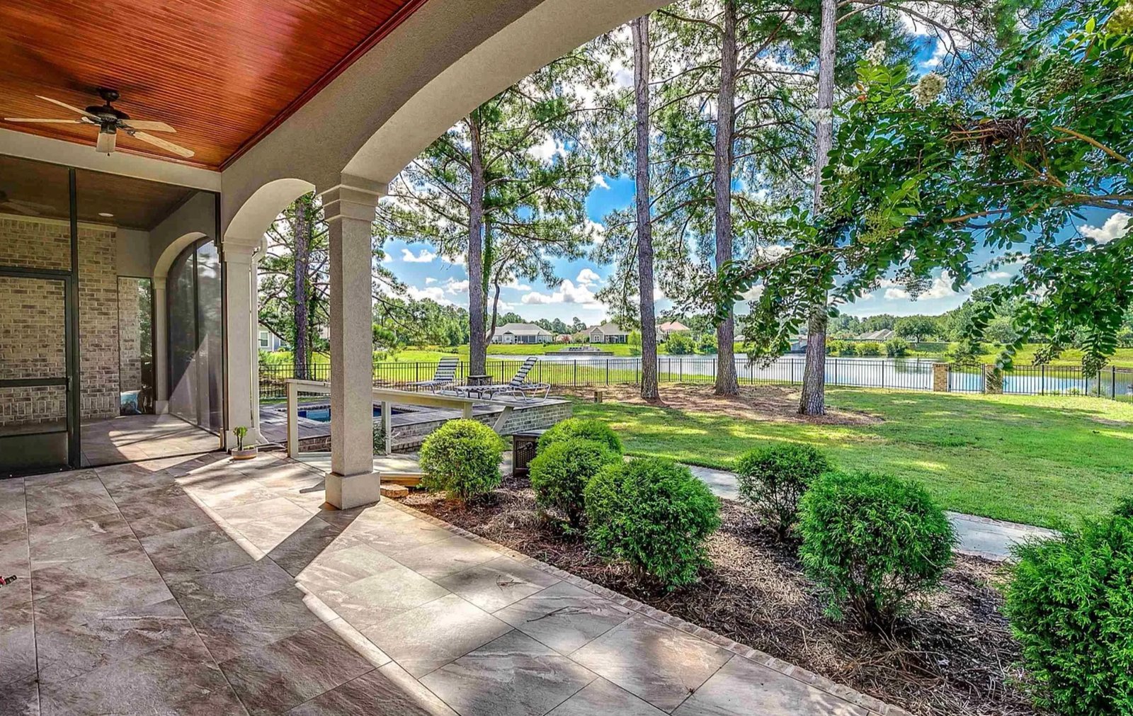 Covered porch overlooking the landscape at 1025 Muscovy
