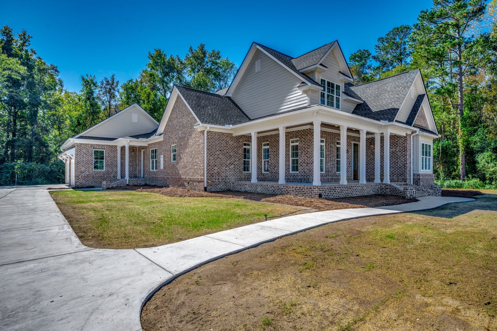 Approach to the finished custom home at 2500 Old Tram