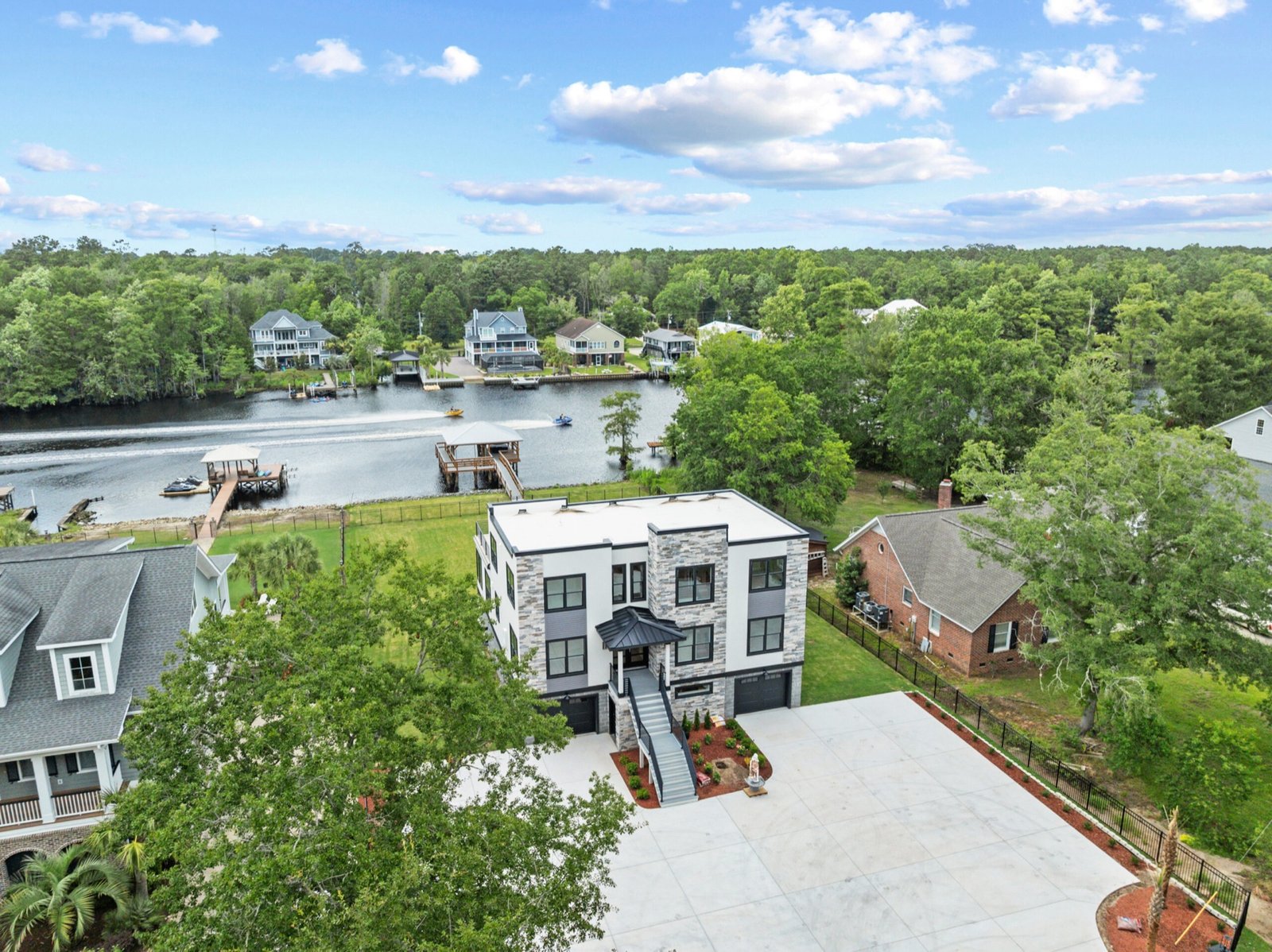 Aerial view of the 2405 River Road custom home on the waterfront